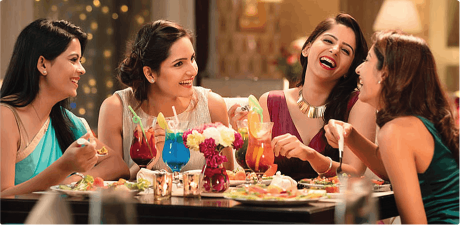 Four women enjoying a meal