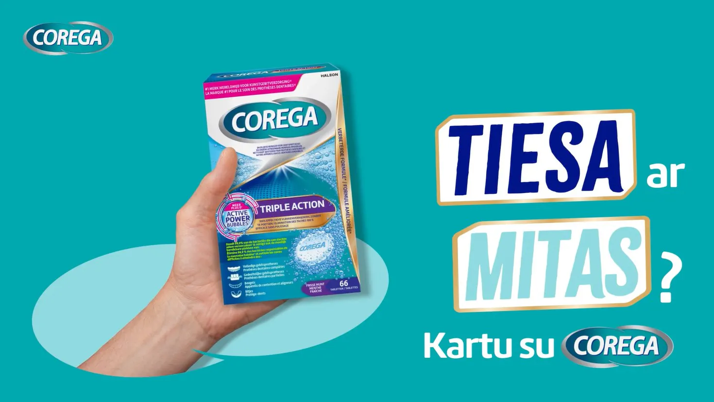 Corega fikseravimo kremas rankoje su užrašu