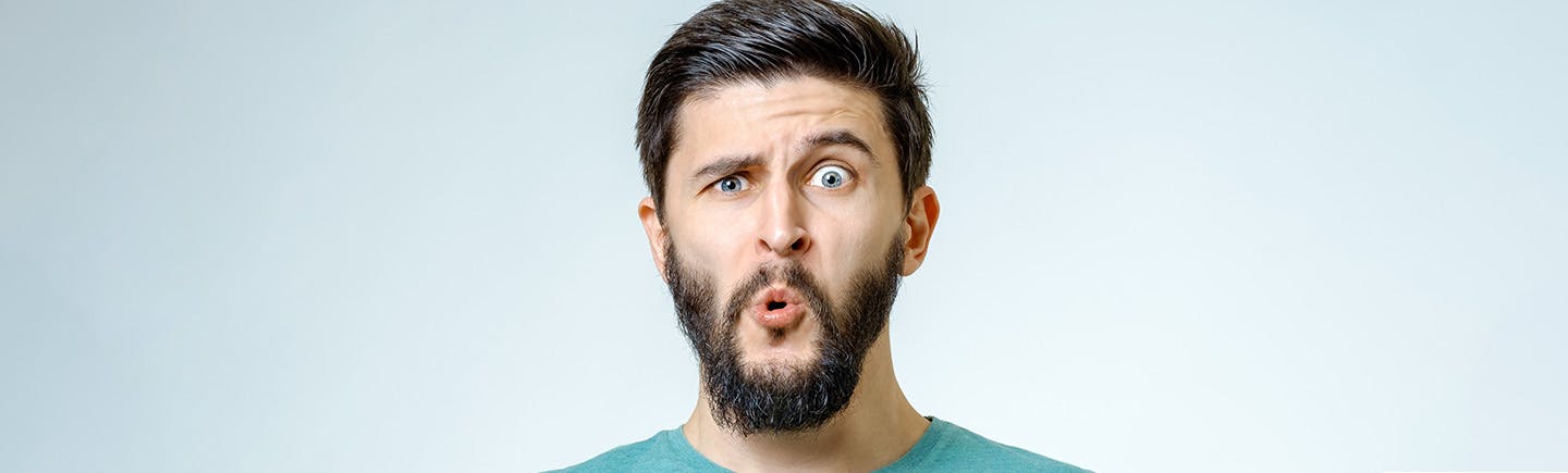 Young healthy man breathes freely probably after using a decongestant spray, which relieves conditions from cold to sinusitis and hay fever.