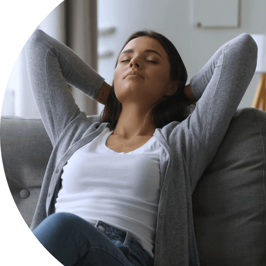 Young woman relaxing on a sofa 