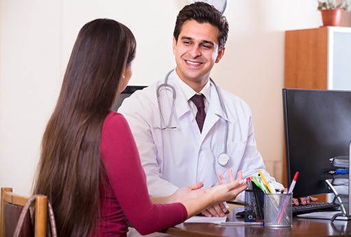 Elderly female patient buys medication at the pharmacy.