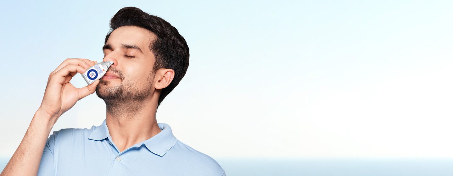 A man appears to breathe freely in a serene environment
