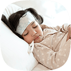 Young sick girl sleeping with a thermometer in her mouth