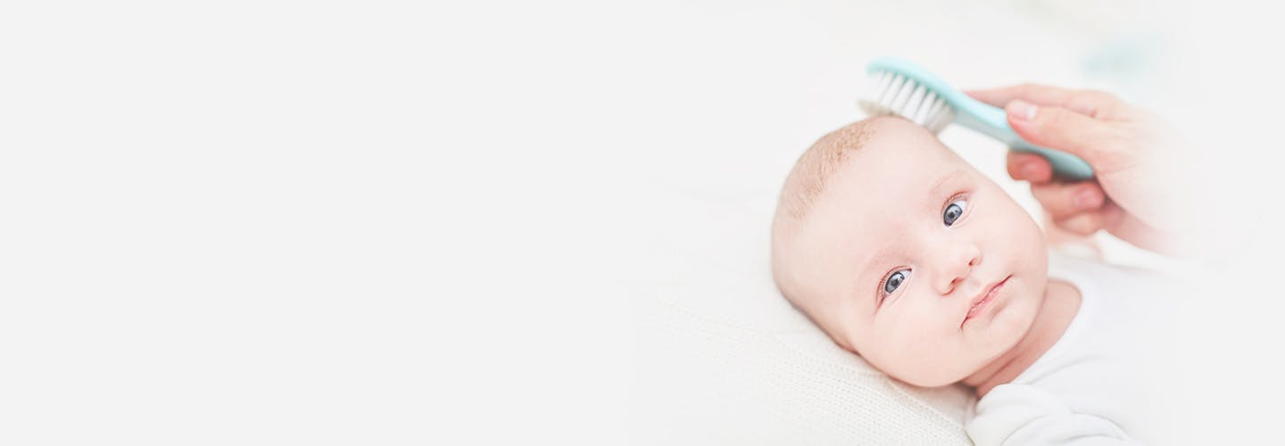 brush removes dandruff skin on newborn baby