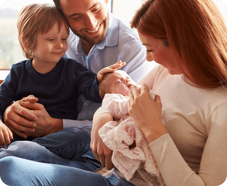 Happy young family with a newborn little baby