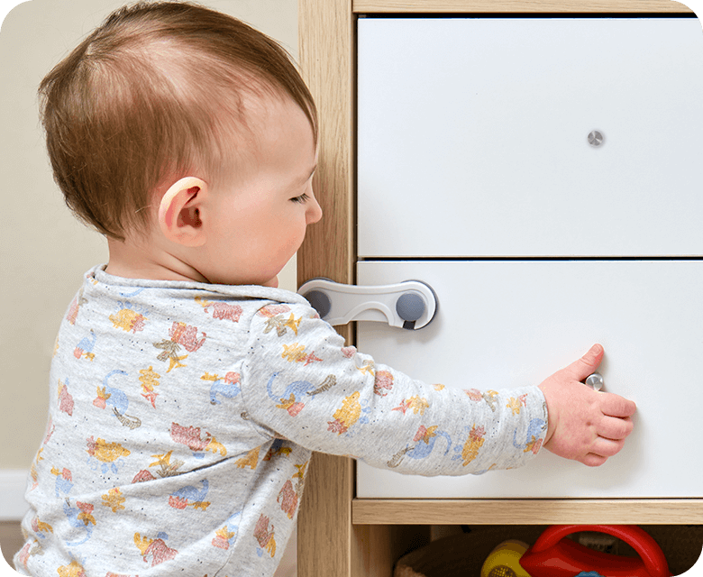 Baby toddler reaches into electrical outlet