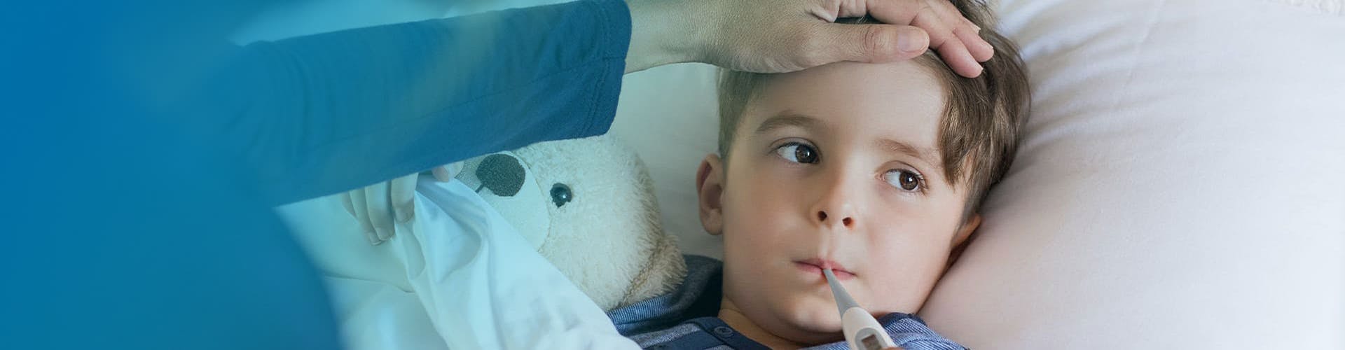 Mother taking her child's temperature using a digital thermometer.