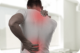 Man holding his back and shoulders in pain 