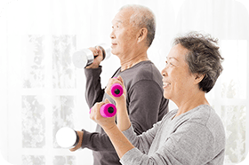 happy senior couple exercising with dumbbells