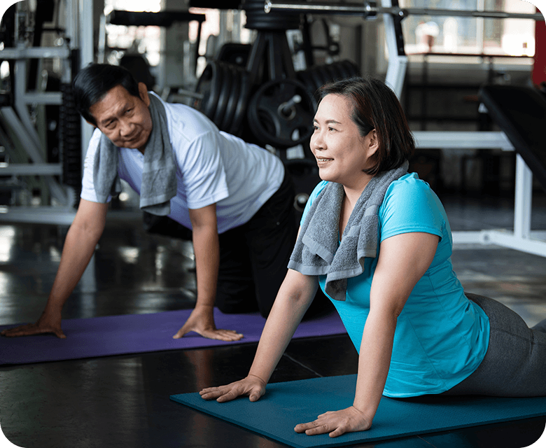 Asian man and woman stretching exercise