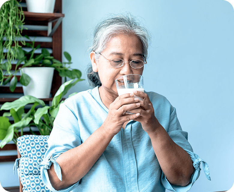 Asian elderly women drinking milk