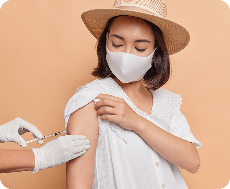 horizontal shot asian woman wears protective mask and getting vaccinated
