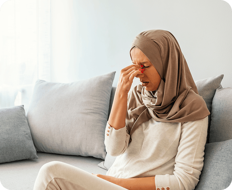 Woman Experiencing A Migraine