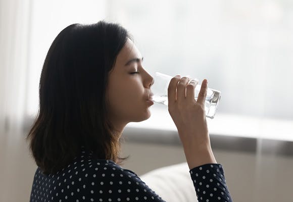 Woman drinking still water