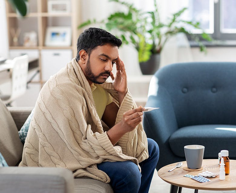 Man hugging a woman on the couch