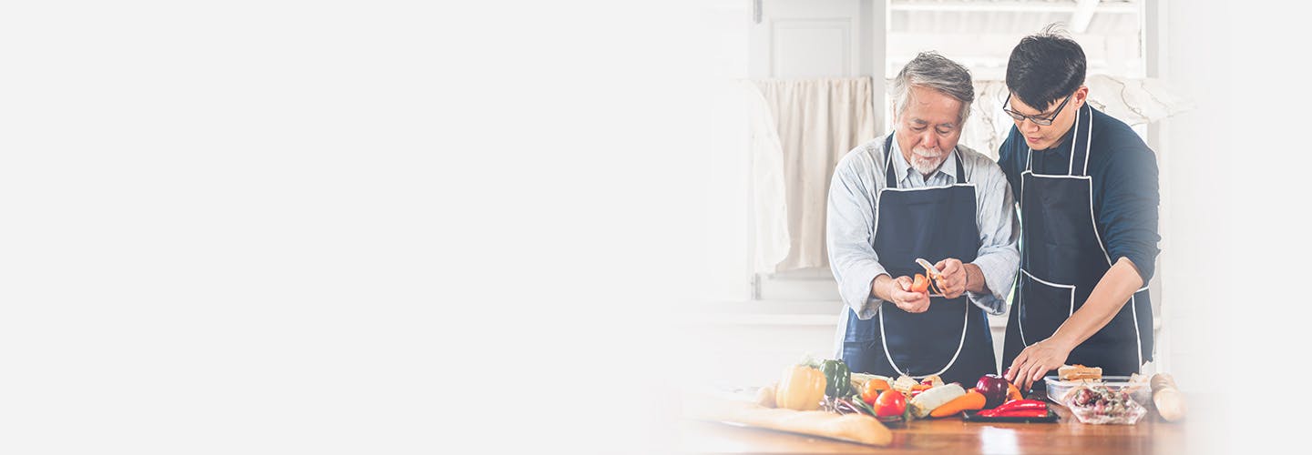 Father and son cooking together