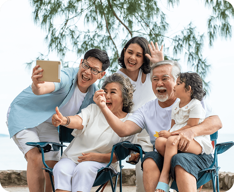 multi generation asian family using tablet to making a photo