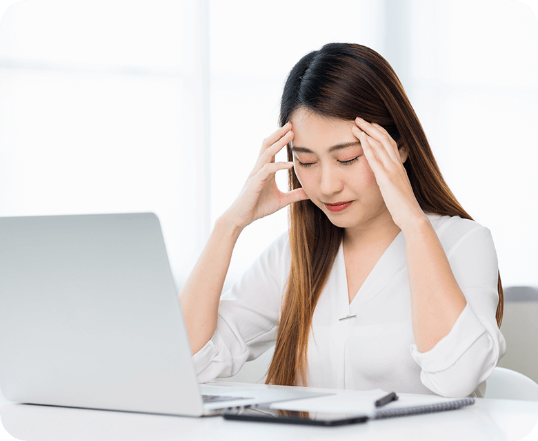 young asian business woman touching her head