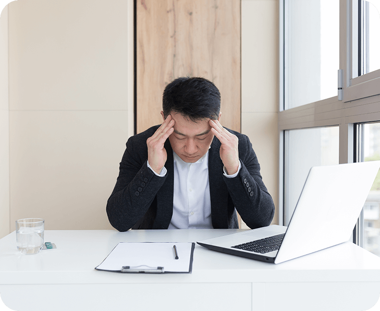 young asian office worker suffering headache