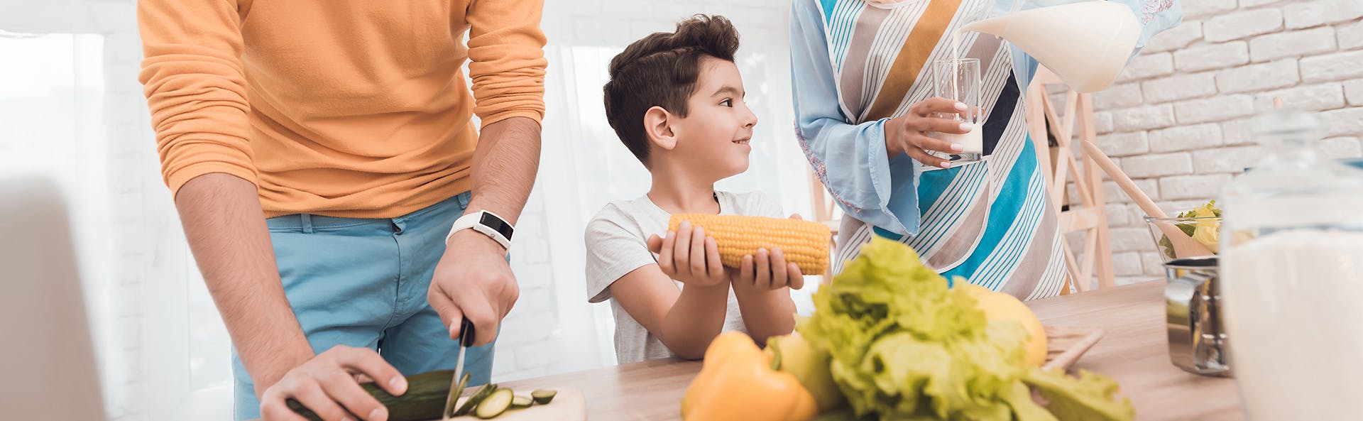 A family preparing a meal together A family preparing a meal together