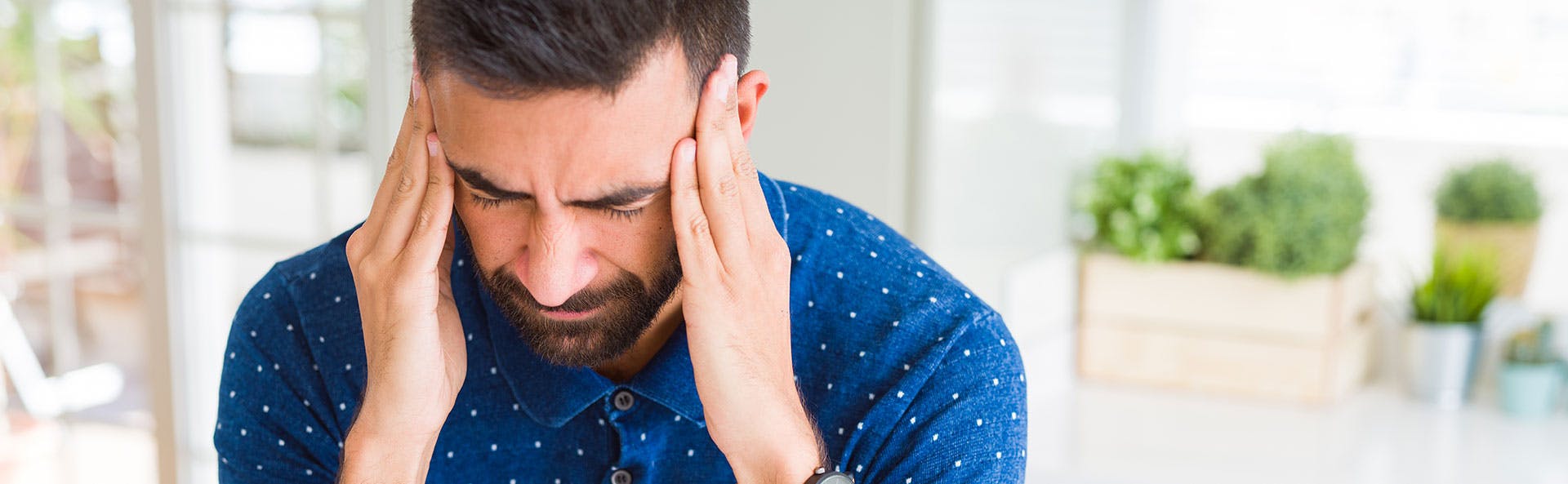 A man coughing and suffering from body aches A man coughing and suffering from body aches
