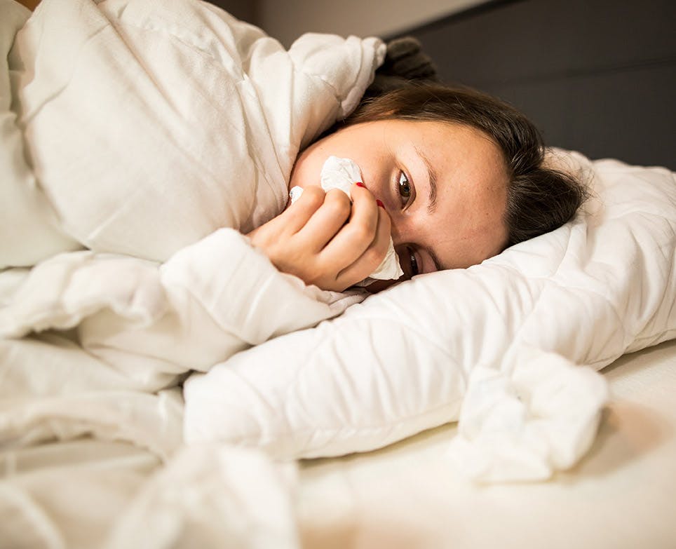A woman in bed with a cold A woman in bed with a cold