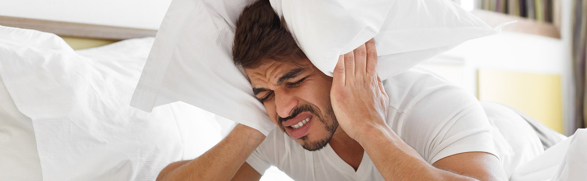 A man suffering from a headache A man suffering from a headache