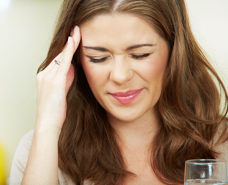 A woman dealing with a headache