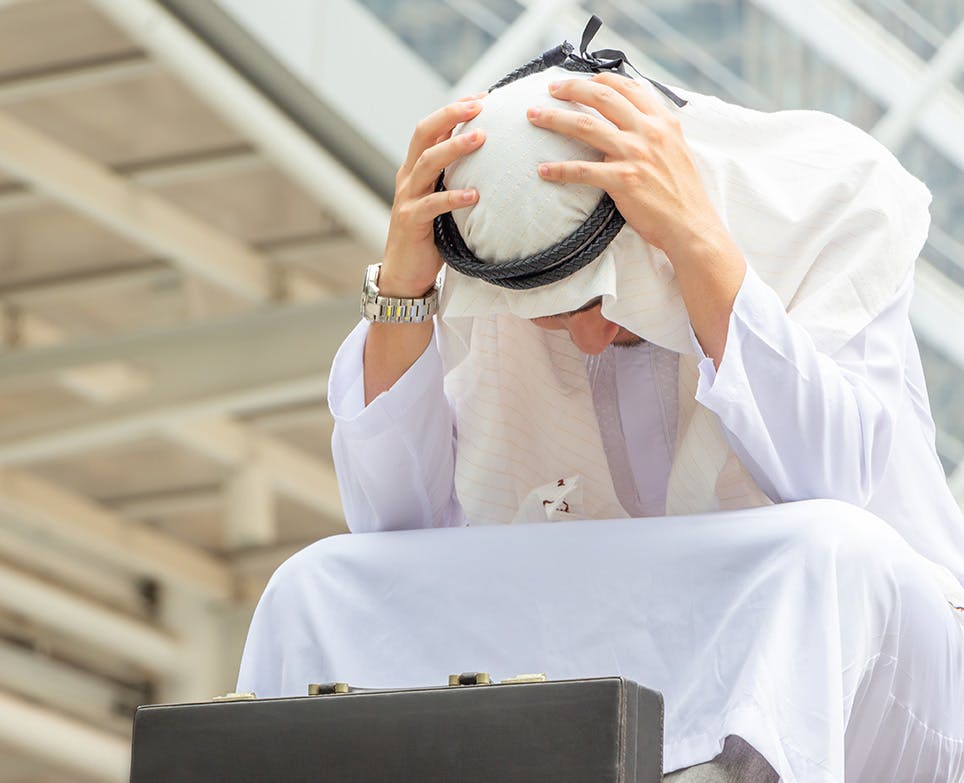 A businessman dealing with a headache A businessman dealing with a headache