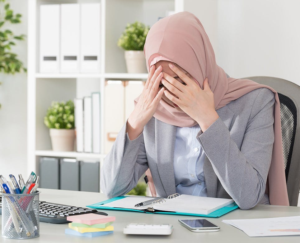 A working woman dealing with a headache