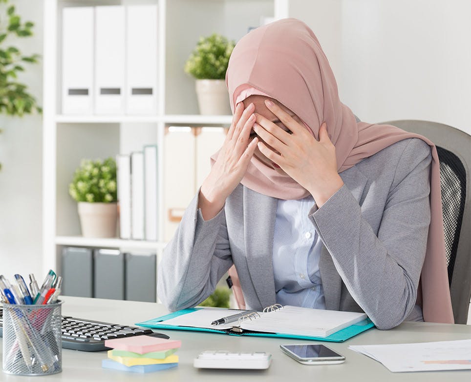 A working woman dealing with a headache A working woman dealing with a headache
