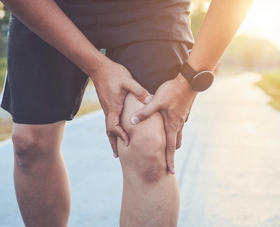 An athlete suffering from a torn muscle An athlete suffering from a torn muscle