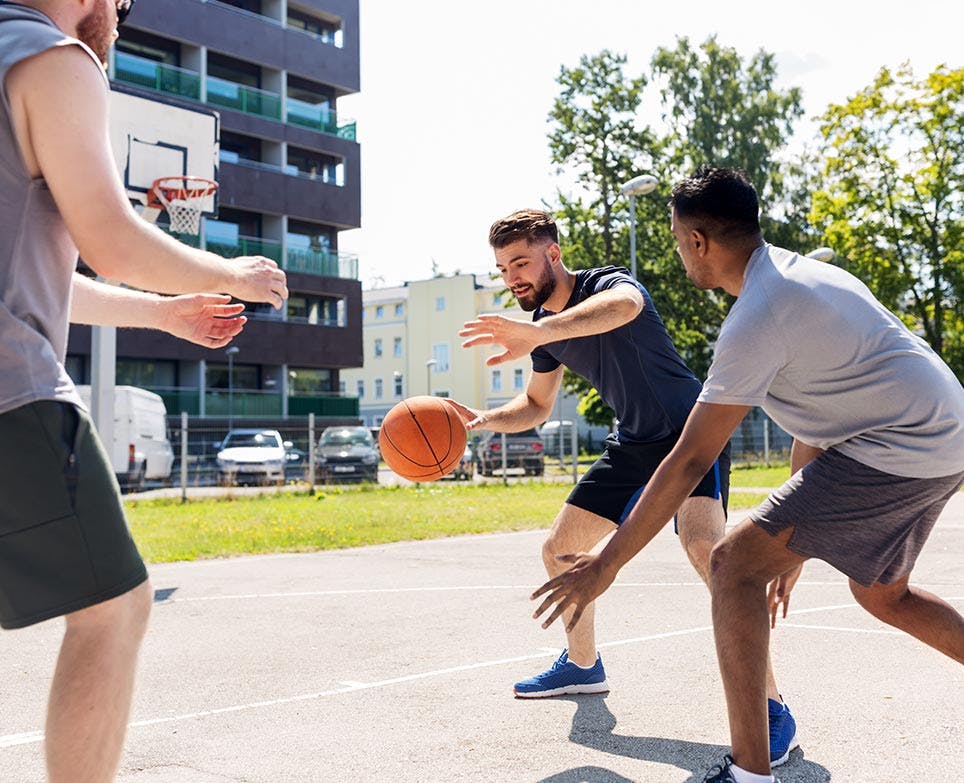 Men playing basketball Men playing basketball