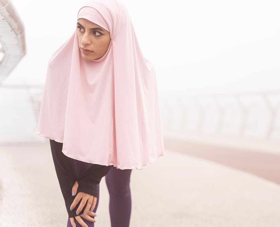 A woman dealing with muscle aches A woman dealing with muscle aches