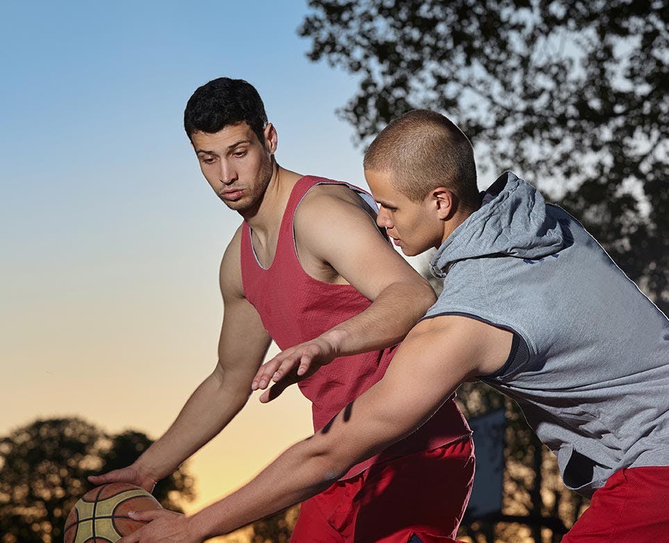 Two men playing basketball Two men playing basketball