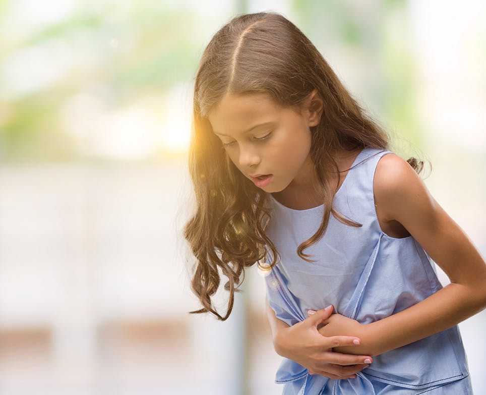 A girl dealing with stomach ache A girl dealing with stomach ache