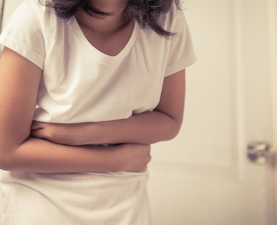 A girl suffering from a stomach ache A girl suffering from a stomach ache