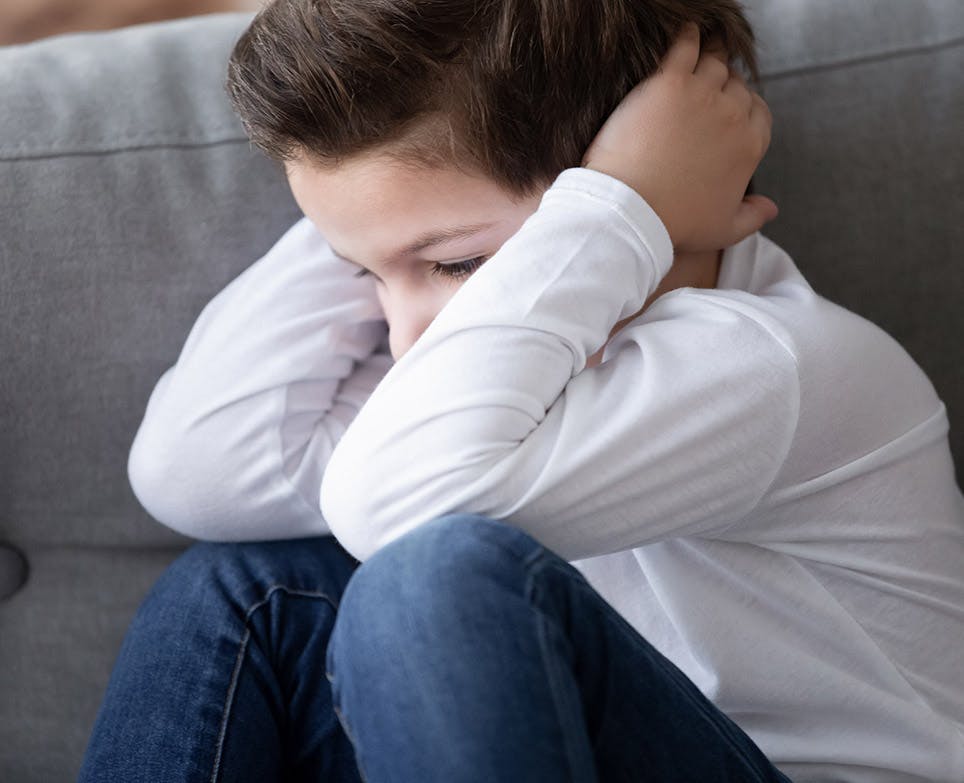 A boy with pain in the ear A boy with pain in the ear