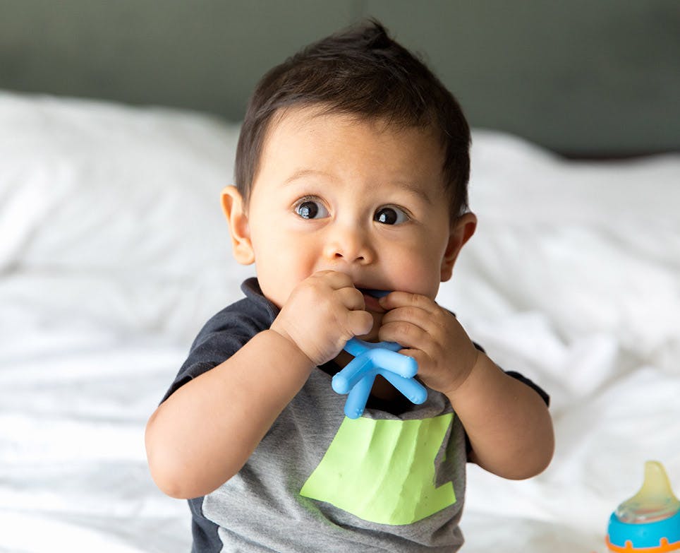A baby using a teether