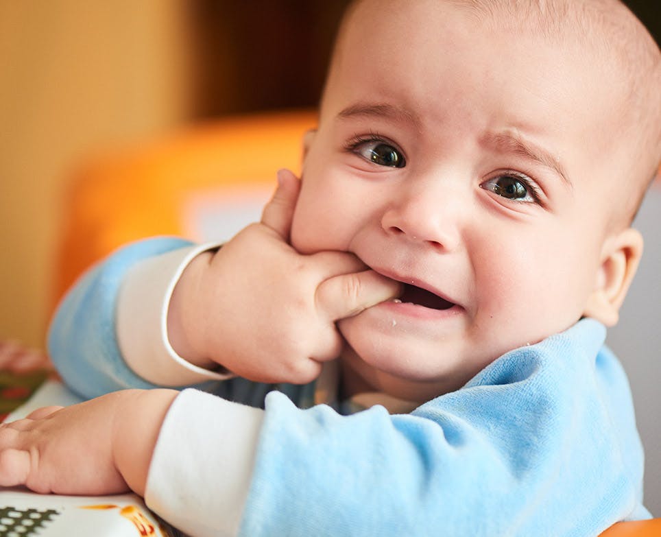 A baby dealing with toothaches