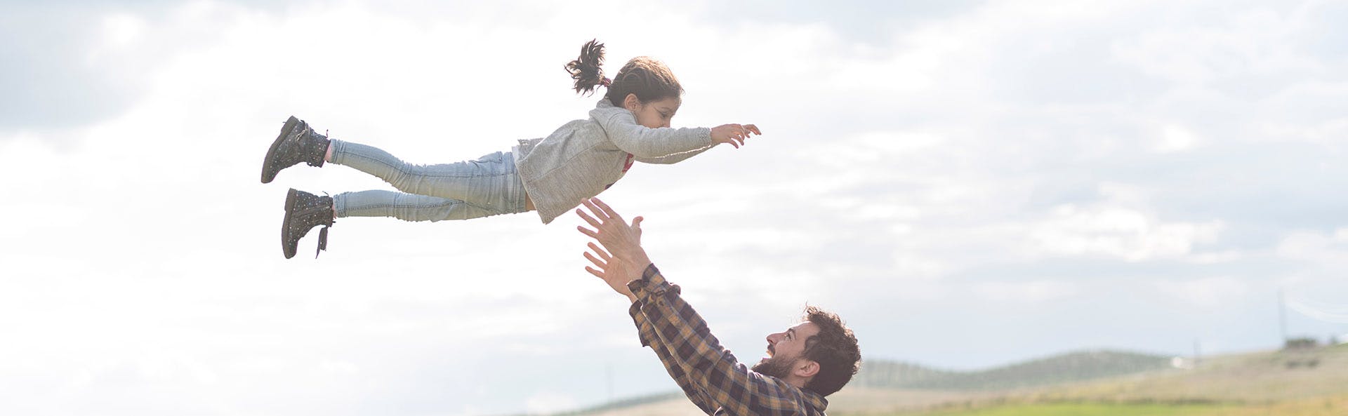 Father playing with his daughter. 