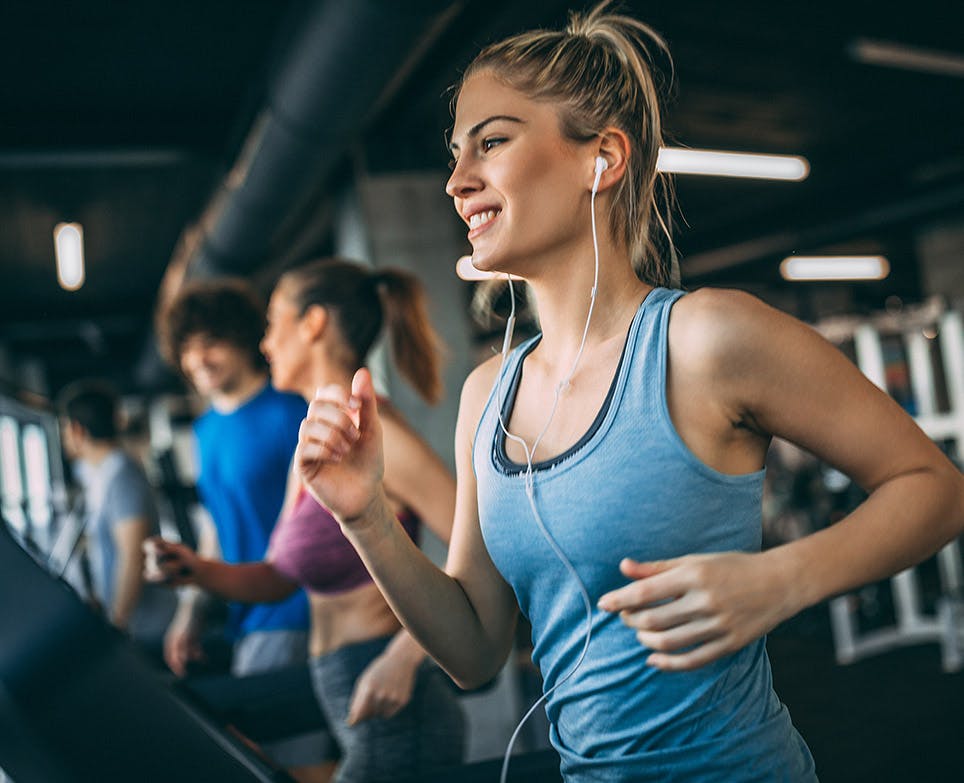 Woman jogging while listening to music. 