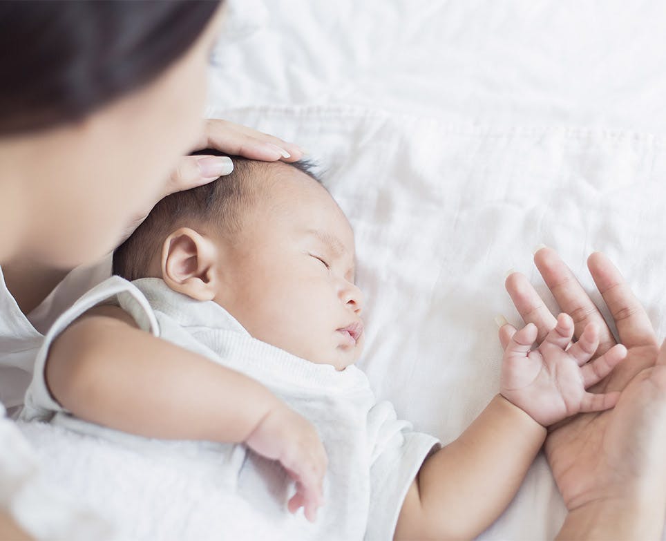 Mother taking care of her baby. Mother taking care of her baby.