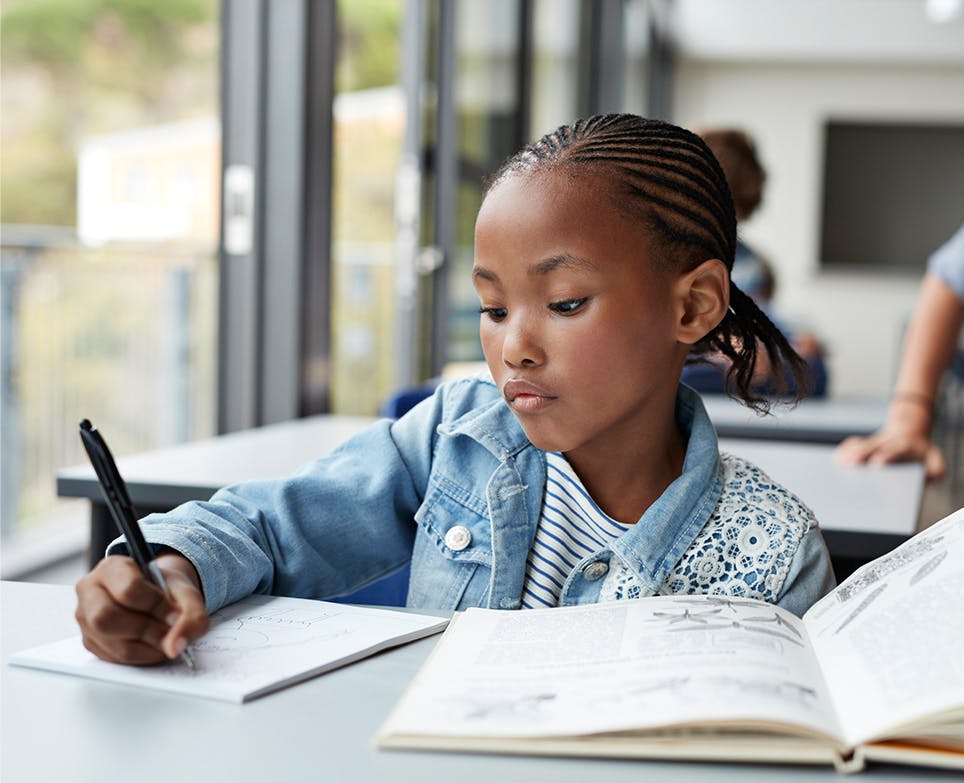 Girl writing in the notebook