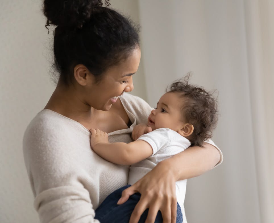 Woman holding her child