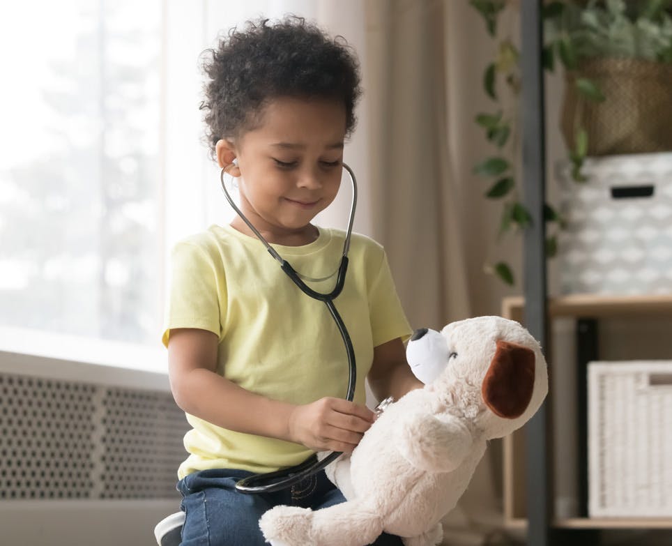 Little boy playing a doctor