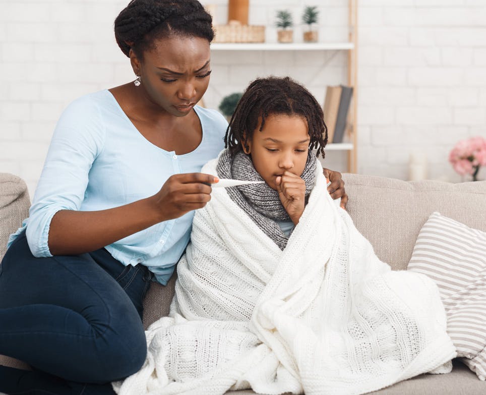 Mother looking after her sick child