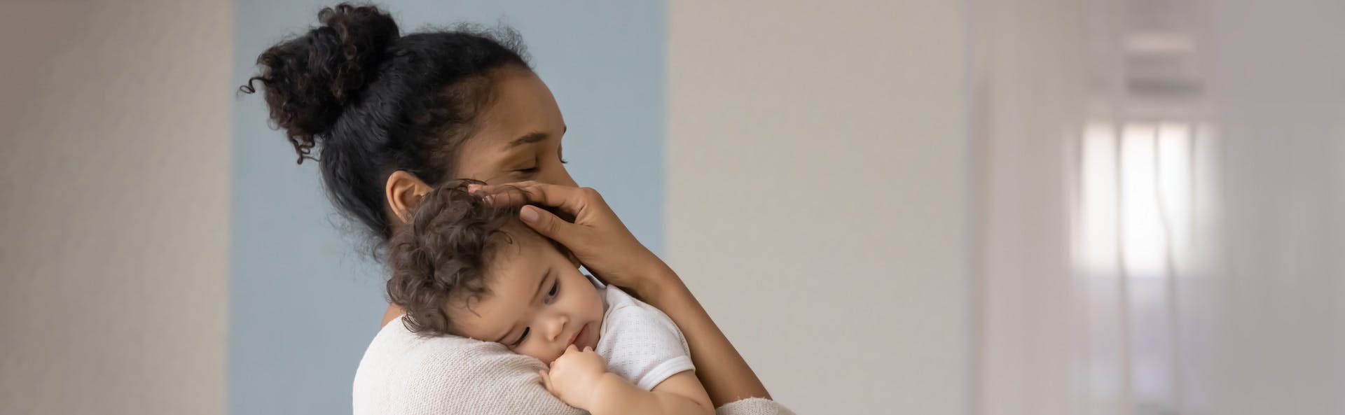 Woman holding her child