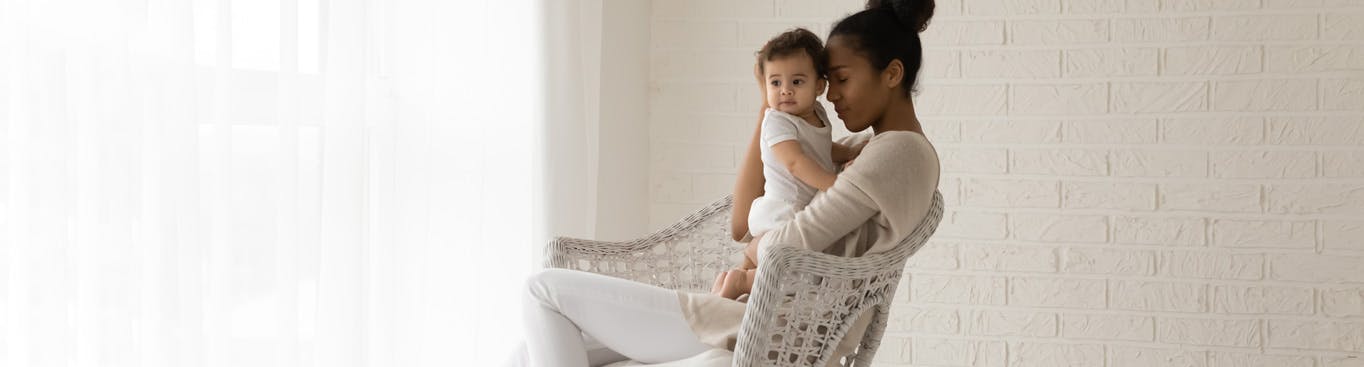 Woman holding her child