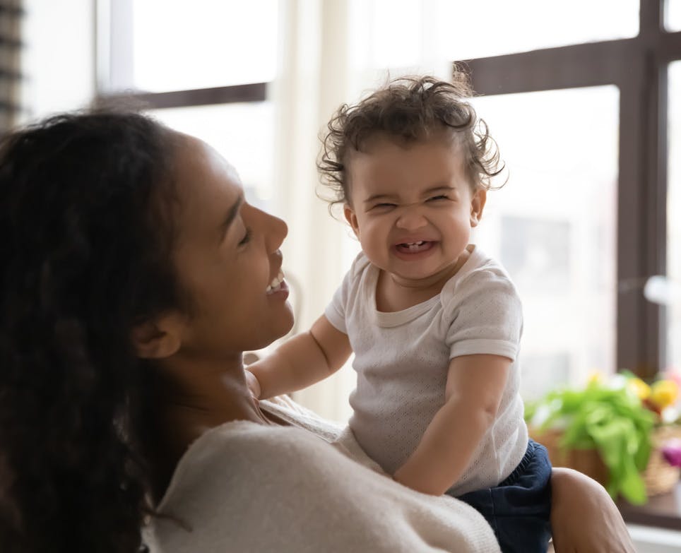 Woman holding her child